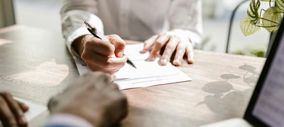 Person reviewing tribal lending loan documents